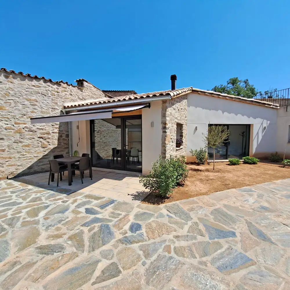 Exterior View Of Casa Terradets Exterior view of Casa Terradets holiday home and courtyard patio in Gavet de la Conca near Tremp.