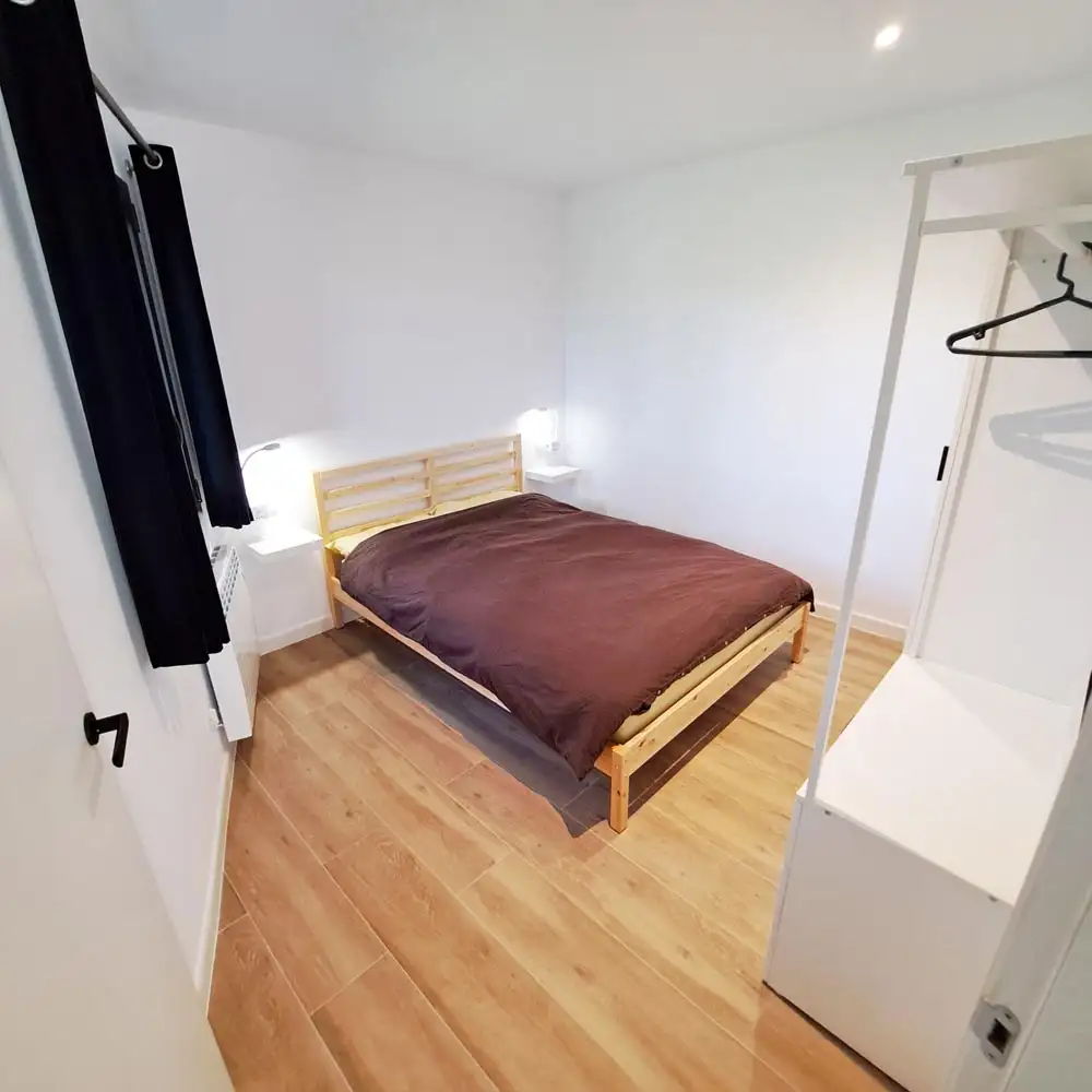 Second Guest Bedroom Cosy second bedroom with double bed, reading lights and premium mattress setup for guests.